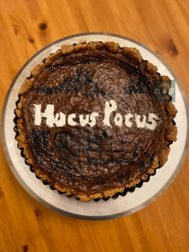 All images are of a Hocus Pocus inspired pumpkin pie with painted black decoration and icing sugar "Hocus Pocus" writing on the top. 