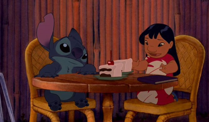 Lilo and Stitch with their dessert cake.