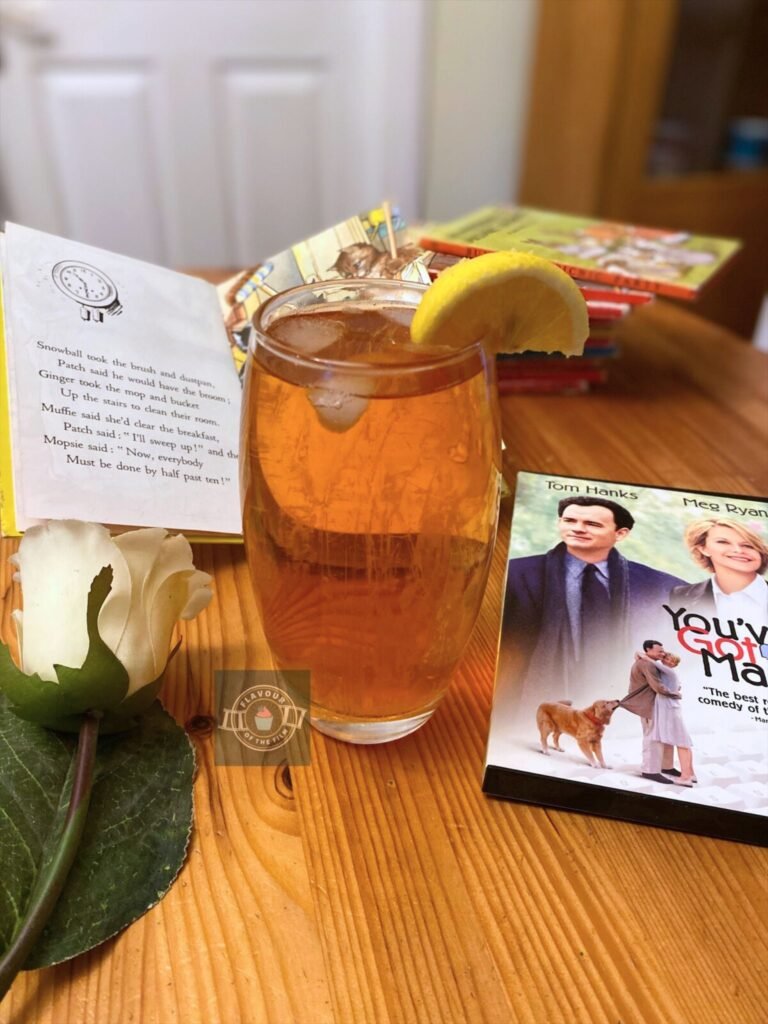 A glass of iced tea with a lemon wedge. Props as listed previously.