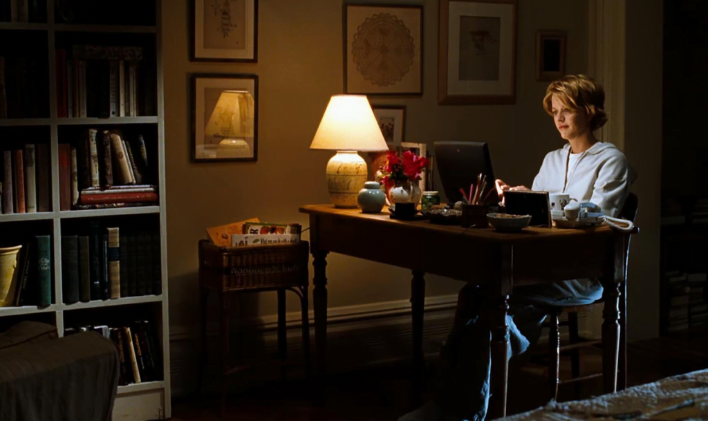 Kathleen sitting at her computer, writing to Joe.