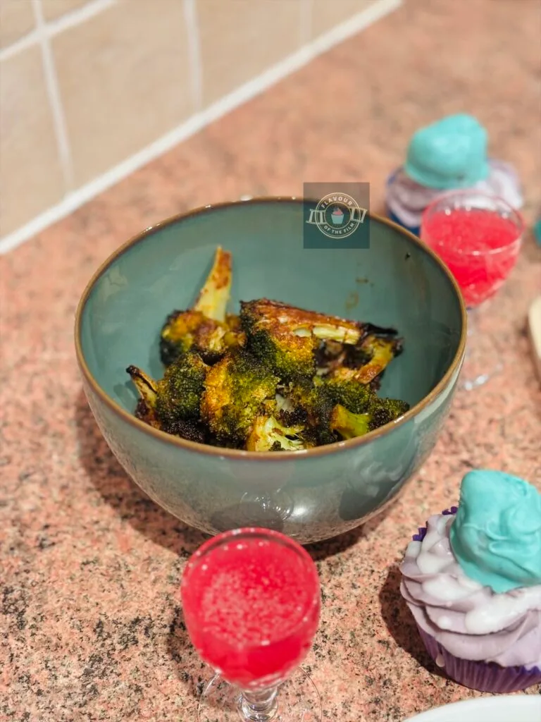 Roasted and spiced broccoli in a serving bowl.