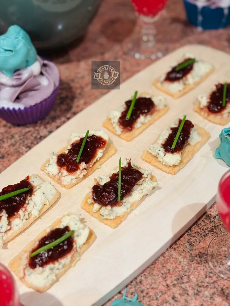 Cheese crackers topped with boursin, spiced plum chutney and fresh chives.