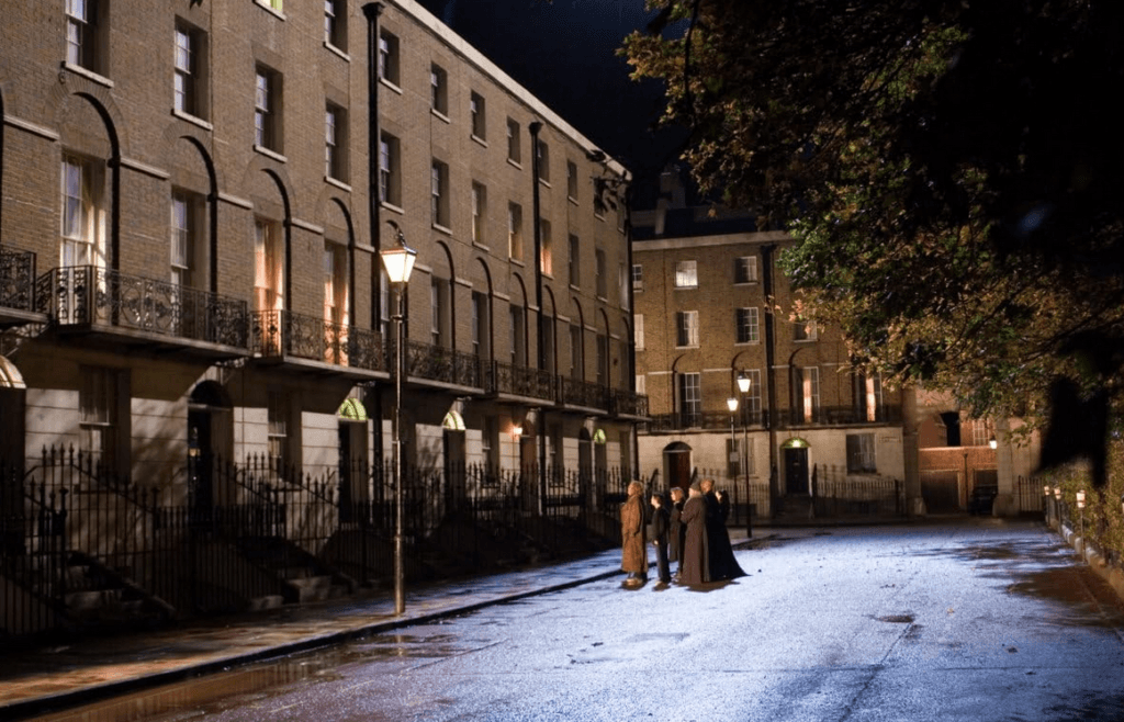 Harry and the Order outside Grimmauld Place, waiting for no.12 to emerge.