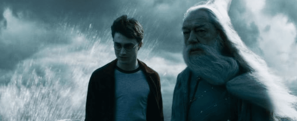 Harry and Dumbledore about to head into the cave to find the locket in Harry Potter and the Half-Blood Prince.