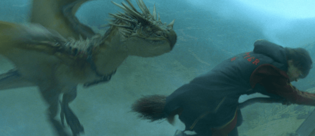 Harry flying with the dragon close on his broom tail in Harry Potter and the Goblet of Fire.