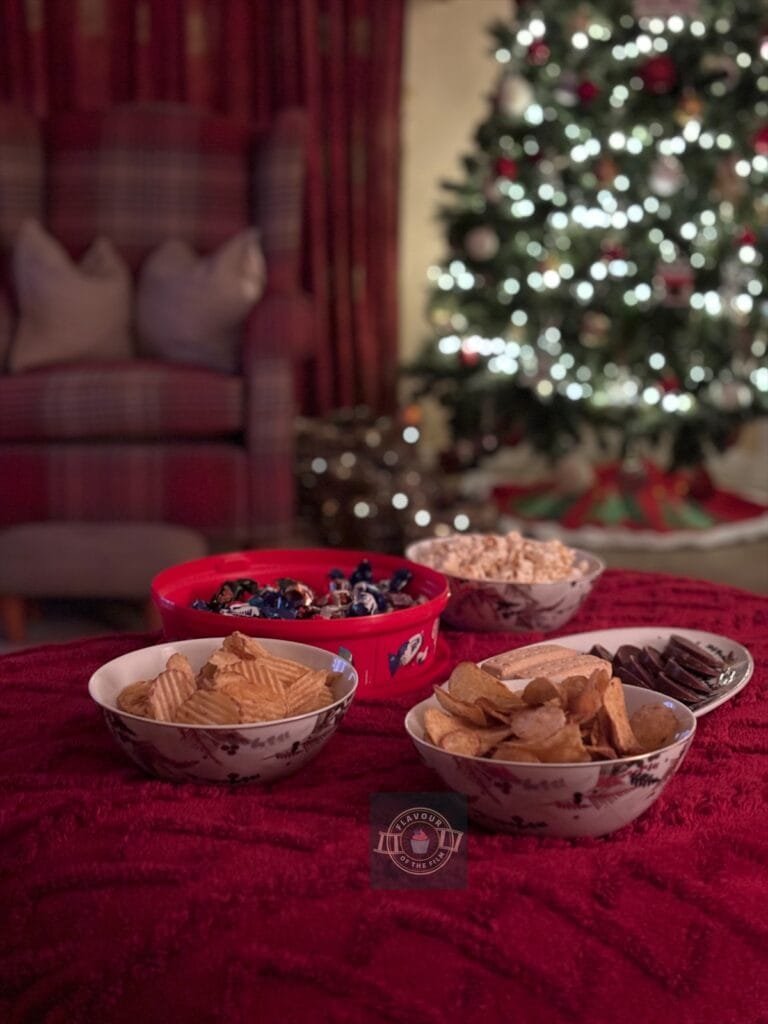 Snacks in front of the Christmas tree.