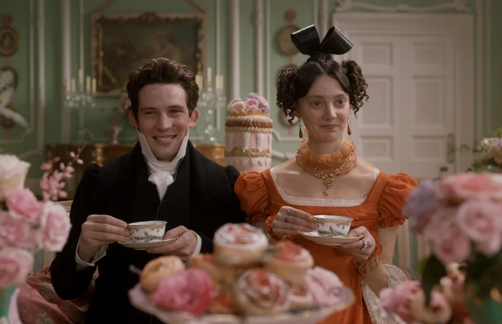 Mr. and Mrs. Elton grinning over their tea.