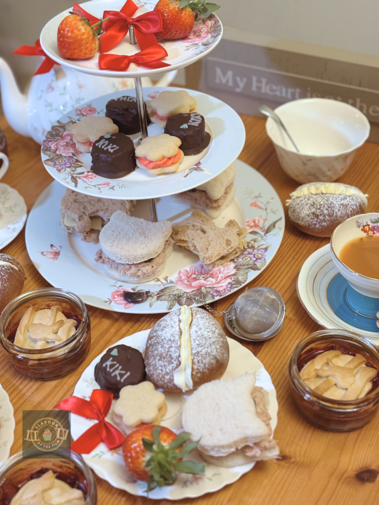 All images are of a Kiki's Delivery Service anime tea party spread, served on a floral three tiered stand with floral teapot and teacups as props.