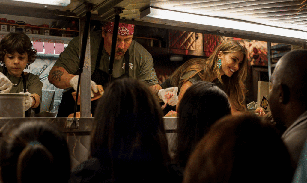 The main characters serving customers from their food truck.
