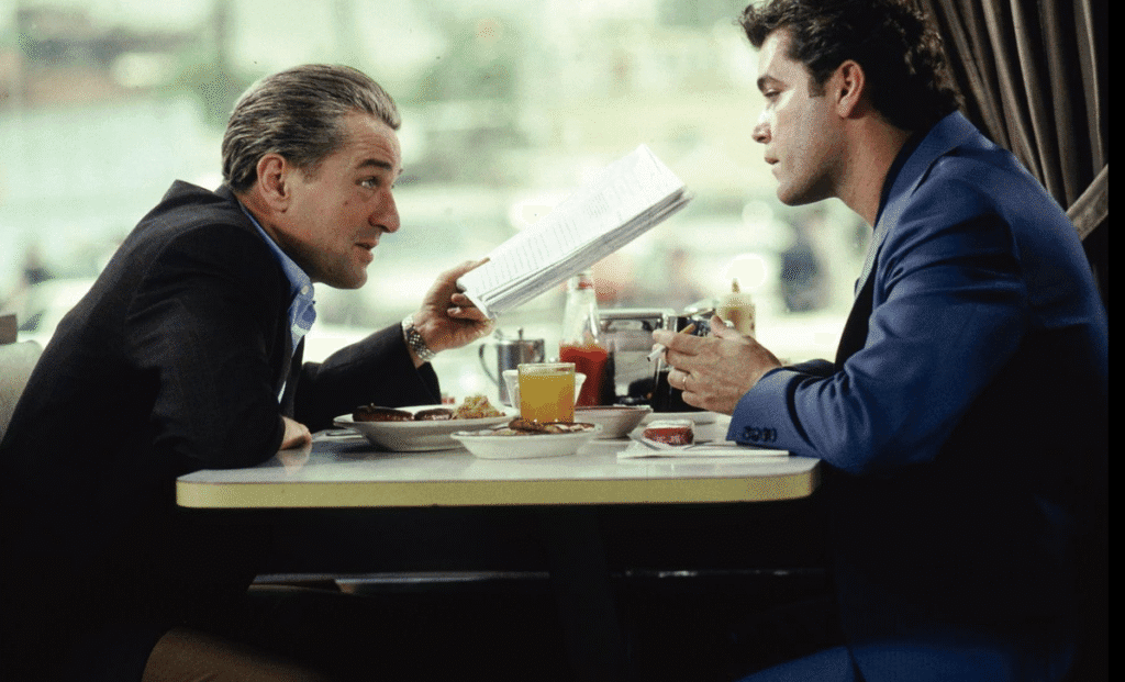 Lead characters having an important discussion over food.