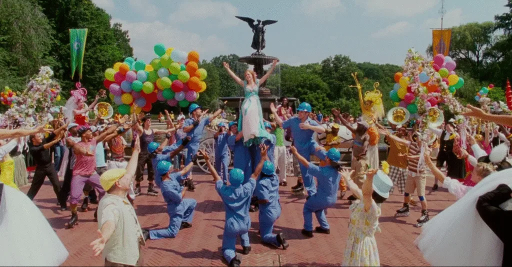 Giselle singing in public with everyone joining in.