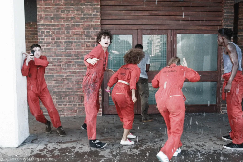 The gang of young offenders getting rained on.