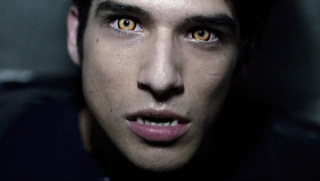 Scott McCall's face with beta eyes and fangs.