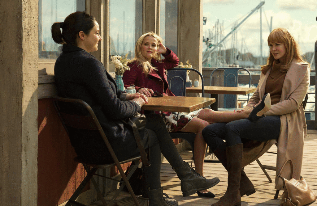 The leading mothers having a chat outside a waterside cafe.