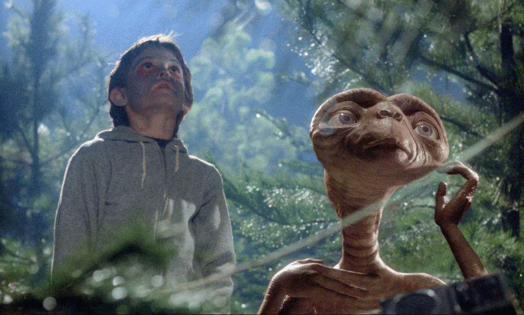 Elliot and E.T. looking up at the night sky.