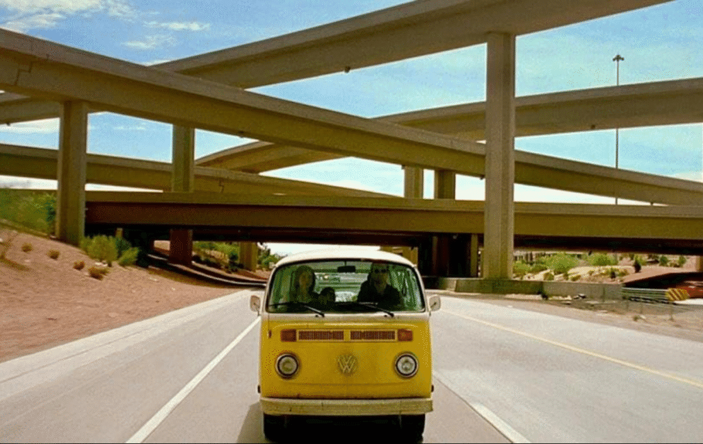 The yellow Volkswagen in the movie driving on the road.