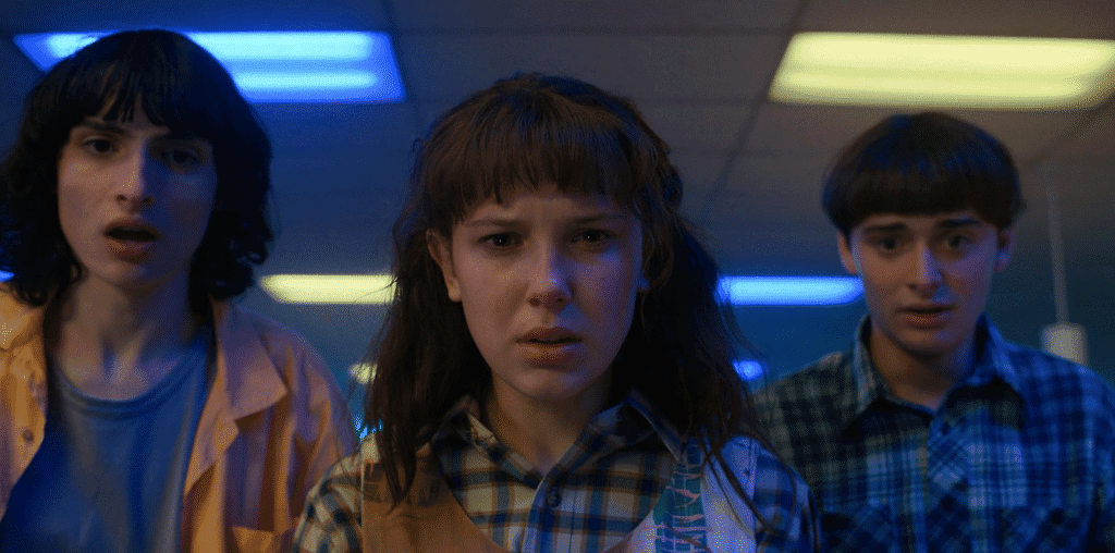 Three main characters looking shocked.