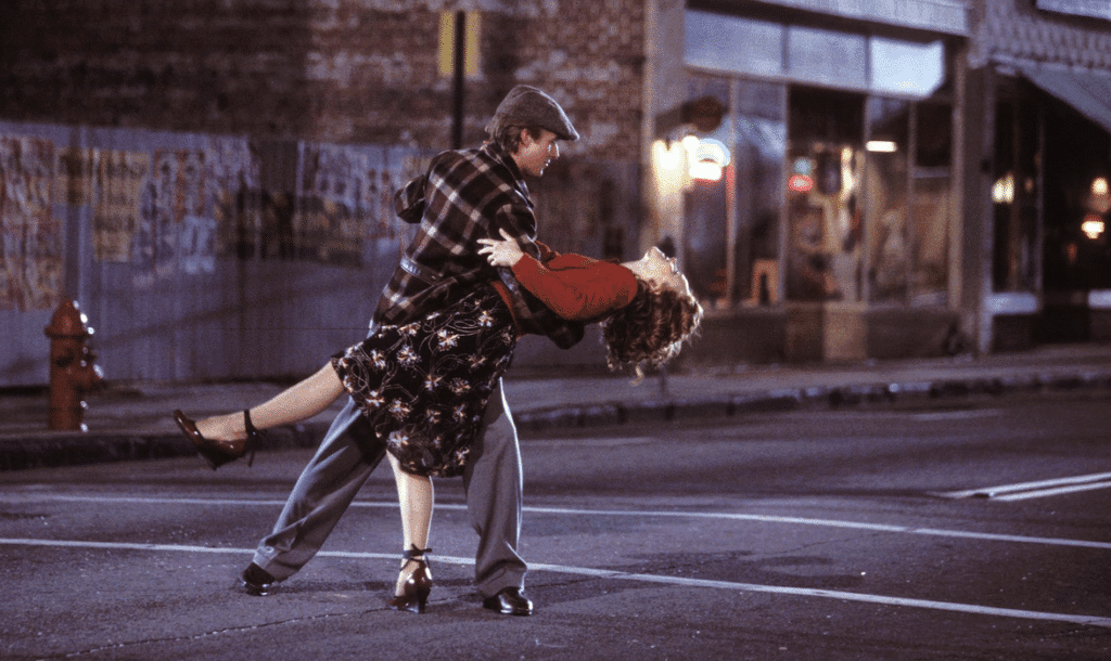 Allie and Noah dancing in the road.