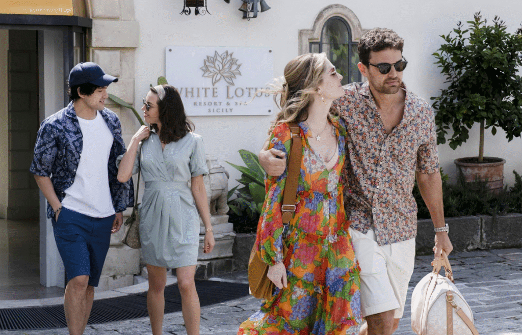 Two couples walking into The White Lotus hotel.