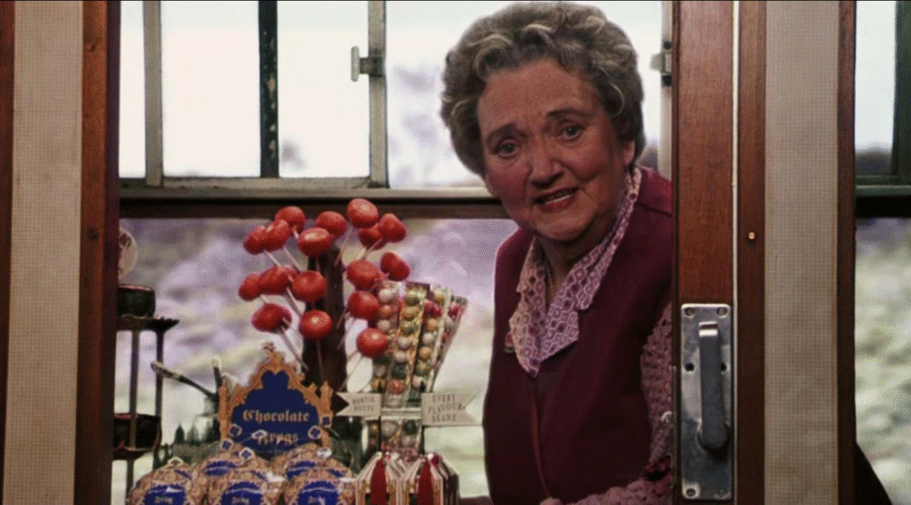 Trolley lady on Hogwarts Express offering snacks.