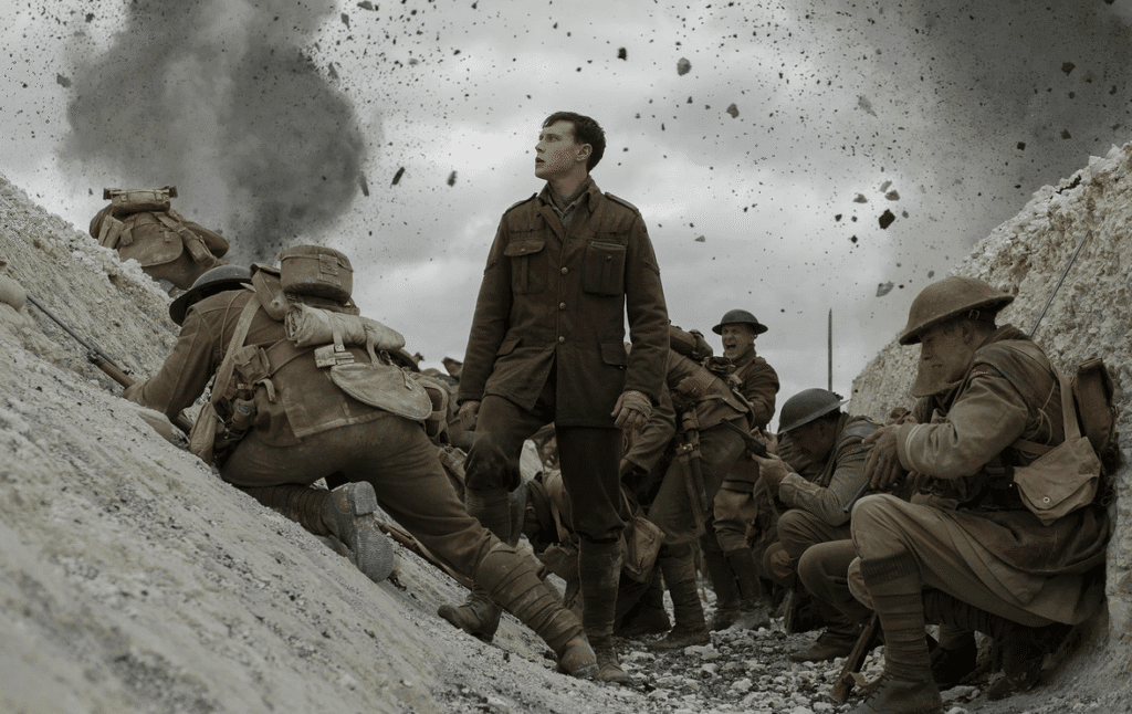 Trenches full with soldiers and pieces of earth flying in the air.