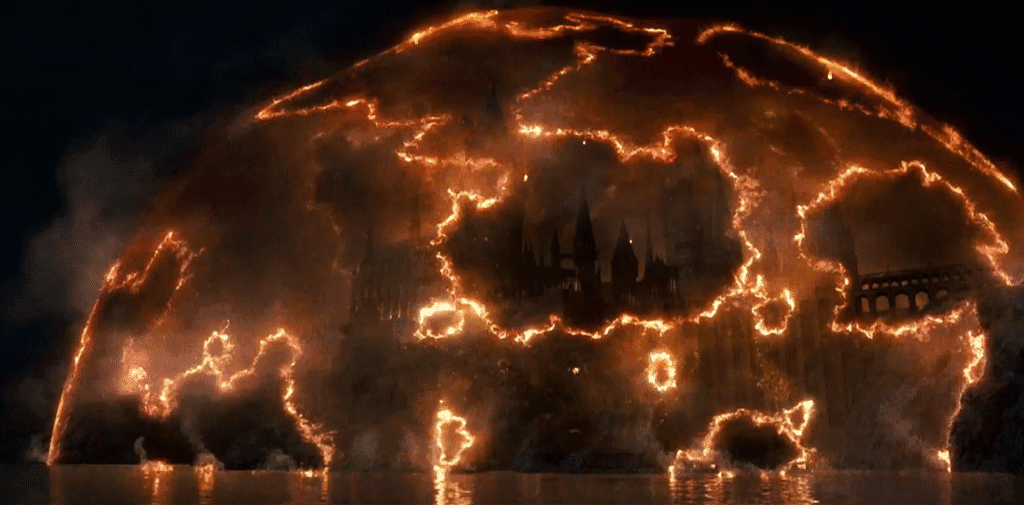 The magical barrier around Hogwarts burning up.
