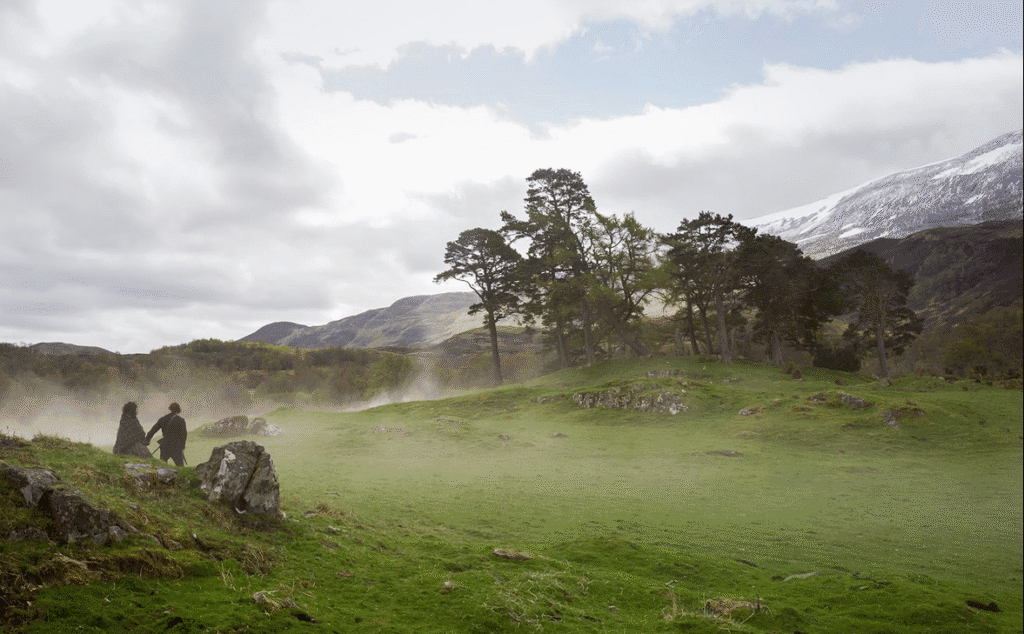 Claire and Jamie walking to the stones.