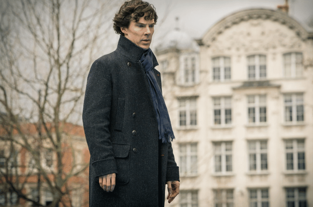 Sherlock standing in the street.