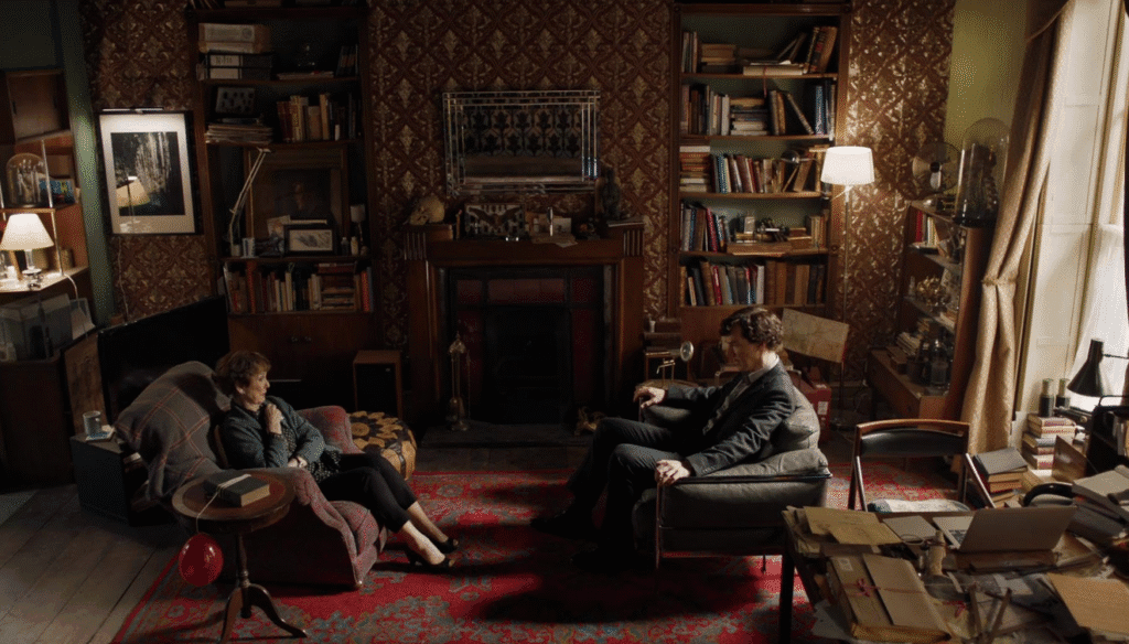 Mrs. Hudson and Sherlock chatting in 221B.